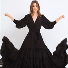 Black Maxi Dress, Long Sleeves With Gathered Cuffs, Overlapping V-Neckline, And Cut-Out Skirt. Fully Lined Skirt. 100% Rayon, Lining: 100% Rayon New With Tags, Size Xs, Fits True To Size Black Maxi Dress With Surplice Neckline For Fall, Black Flowy Maxi Dress With Surplice Neckline, Black Flowy V-neck Maxi Dress, Black Flowy Dress With Surplice Neckline, Flowy Black Maxi Dress With V-neck, Chic Black Maxi Dress With Surplice Neckline, Black Maxi Dress With Surplice Neckline For Evening, Black Fitted Maxi Dress With Surplice Neckline, Maroon Gown