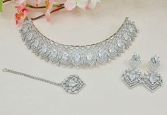 Silver Plated American Diamond choker Necklace set .  Jewellery Care -- Keep all the jewellery away from water , perfumes and other harsh chemicals  To clean wipe with lint free cloth to retain the shine . Diamond Choker Set, Necklace Set Silver, Pink Jewelry Set, Wedding Jewelery, Diamond Choker Necklace, Silver Choker Necklace, Indian Jewelry Sets, Diamond Choker, Choker Necklace Set