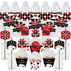 casino themed party supplies including cupcakes, candy sticks and water bottle wrappers