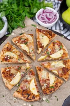 a pizza sitting on top of a wooden cutting board