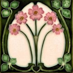 a decorative tile with pink flowers on green and white tiles in the shape of an arch