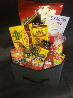 a basket filled with lots of food and condiments