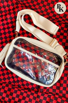 Get game day ready with our White Game Day Clear Cross Body Bag! This stylish, clear stadium purse is designed to meet stadium regulations and features a convenient zipper closure, removable strap, and an adjustable strap for comfort. The clear front pocket and removable tassel add a touch of flair. Available in Black and Red as well. Check out this essential accessory for all your game day needs. Learn more here! White Bags With Clear Strap For On-the-go, White Crossbody Bag With Zipper Closure, White School Bag With Clear Strap, White Shoulder Bag With Zipper Pouch For On-the-go, White Crossbody Bag With Clear Strap, White Crossbody Shoulder Bag With Zipper Pouch, White Shoulder Bag With Clear Strap For On-the-go, White Shoulder Bag With Clear Strap, White Bag With Clear Strap For Everyday Use