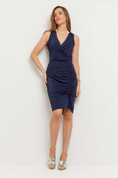 Make an entrance with confidence in the Avana Dress. This sleek style features ruching down the front skirt for an adjustable, bespoke fit and the faux-wrap front completes the flattering silhouette. Wrinkle-resistant so it’s a traveler’s dream, the Avana Dress is a one-and-done, do-it-all piece that simplifies packing and traveling. Take off, take a meeting, take some me-time, but never check a bag. Slim fit V-neck Sleeveless Faux wrap front Adjustable ruching on skirt Pullover style Length hit Fitted Ruched Wrap Dress Midi Length, Fitted Sleeveless Ruched Wrap Dress, Fitted Sleeveless Wrap Dress With Ruched Details, Fitted Ruched Wrap Midi Dress, Fitted Ruched Midi Wrap Dress, Elegant Fitted Ruched Wrap Dress, Ruched Surplice Neckline Midi Dress For Work, Ruched Midi Dress With Surplice Neckline For Work, Fitted Ruched Midi Dress With Surplice Neckline