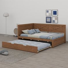 a bed sitting on top of a hard wood floor