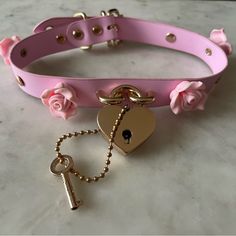 New, No Tag, But Never Worn! Choker W/ Adjustable Buckle Closure Necklace. Powder Pink Color With Gold Buckle And Lock/Key Details. Lock Actually Opens With Attached Key! Delicate Pink Rose Details Around The Choker. Purchased At Hot Topic. Perfect For Halloween And A Costume Or Valentines Day! Pink Collars For Subs, Adjustable Pink Necklace With Rose Design, Buckle Choker, Powder Pink Color, Rose Details, Rosé Details, Pink Collar, Pink Collars, Lock And Key