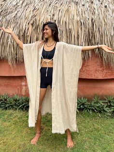 Open long kimono robe in beige handmade from natural textiles - original threads. Crafted from eco-friendly hemp fibers, it offers exceptional comfort and durability. Ideal for lounging at home, its natural breathability ensures comfort throughout the year. Each robe is made with care for quality and timeless style, appealing to our conscious community that values comfort and sustainability.  Elevate your loungewear with this versatile hemp robe, blending eco-conscious materials with expert craf Beige Bohemian Long Kimono, Beige Long Bohemian Kimono, Beige Open Front Kimono As Beach Cover-up, Beige Open Front Kimono For Beach Cover-up, Beige Open Front Kimono For Beach, Long Beige Kimono For Festival, Beige Long Kimono For Festival, Beige Open Front Beachwear Cover-up, Beige Open Front Kimono For Vacation