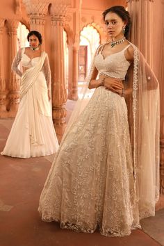 Ivory attached cancan lehenga with all over floral, geometric hand embroidery using resham, pearl, sequin. Paired with a coordinating, padded blouse with beaded danglers and dupatta with floral cutwork embroidered border. - Aza Fashions Cream Choli With Intricate Embroidery, White Anarkali Pre-draped Saree With Intricate Embroidery, Off White Pre-draped Saree With Dupatta For Reception, Off White Dress With Intricate Embroidery For Diwali, Off White Georgette Lehenga With Intricate Embroidery, Saree-shaped Gown With Chikankari Embroidery For Reception, Designer Off-white Lehenga With Pallu, Off White Chikankari Embroidery Sets For Reception, Traditional Off White Gown For Designer Wear