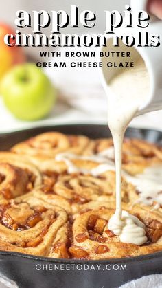 apple pie cinnamon rolls with brown butter cream cheese glaze in a cast iron skillet