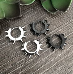 Spike hoop earrings are made of 316 Stainless steel. Hoops are perfect for both men and women. Size of the hoops Face: 4mm Inner diameter: 9mm Outer diameter with spikes: 19.5mm Post: 0.7mm/22g-regular post Sold as 1 pair All items are shipped in a gift box Black Hoop Earrings, Spike Hoop Earrings, Black Hoops Earrings, Punk Earrings, Heavy Earrings, Jewelry Mens, Spike Earrings, Earrings Black, Black Earrings