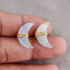 Moonstone Crescent Moon Earring Studs, Moonstone Earrings, Half Moon Studs, Crescent Moon Wire Wrapped Stud Earrings About These Earrings: - Gemstone: Moonstone - Stone Size: 18x7mm - Finish: Gold Plated - Material : 925 Sterling Silver - Handmade in the India You can also have a look on our other amazing similar products here- >Labradorite Crescent Moon Stud Earring- https://www.etsy.com/listing/1203698851/labradorite-crescent-moon-earring-studs?click_key=b28e370d065e33e09fbb26069857191e0f87425 Wire Wrapped Moon Shaped Earrings, Moon Shaped Wire Wrapped Earrings Gift, Moon Shaped Crystal Earrings With Moon Charm As Gift, Crescent Wire Wrapped Earrings As Gift, Crystal Moon Earrings With Moon Charm As Gift, Moon-shaped Crystal Earrings With Moon Charm As Gift, Crescent Wire Wrapped Earrings For Gift, Crescent Moonstone Earrings With Moon Charm, Moonstone Earrings With Moon Charm