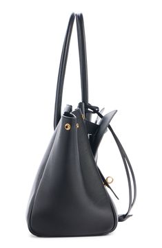 A new icon entered the Balenciaga pantheon of bag styles on the fall '24 runway—the Bel Air crafted from smooth calfskin leather and shaped for shifting with snap side gussets and an almost Escheresque front panel of exterior pockets. Open top Shoulder straps Exterior pockets Structured silhouette with flat base and protective metal feet Leather Made in Italy Designer Handbags Black Bucket Bag With Detachable Handle For Business, Sleek Calf Leather Shoulder Bag For Everyday Use, Black Business Bucket Bag With Detachable Handle, Luxury Structured Shoulder Bag With Dust Bag, Black Calf Leather Bag With Removable Pouch, Luxury Bucket Bag With Gold-tone Hardware For Everyday Use, Structured Calf Leather Bag With Leather Lining, Designer Black Structured Bag, Everyday Use Structured Leather Bucket Bag