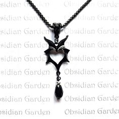 Gothic batwing heart pendant necklace. Pendant has a solid black gloss coating.  With addition bead drop using 4mm black/silver rondelle and black glass drop bead. Solid black plated box chain with lobster clasp fastening. Chain length 60cm, pendant drop length 65x 22mm wide (measurements are approximate). On dispatch this item will be carefully wrapped in tissue paper before being sent in a padded envelope for extra protection. Free delivery in the UK. NOT SUITABLE FOR CHILDREN UNDER 5 YEARS. Black Gloss, Black Plates, Drop Beads, Box Chain, Heart Pendant Necklace, Bat Wings, Black Glass, Necklace Pendant, Chain Length