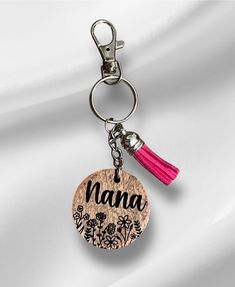 a wooden keychain with the word nana on it