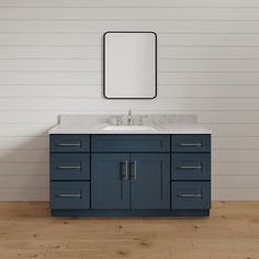 a bathroom vanity with two sinks and a mirror on the wall next to a wooden floor