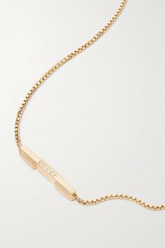 Gucci's necklace is part of the label's 'Link to Love' collection, which explores modern romance. It has been made in Italy from polished 18-karat gold and strung with a slim bar etched with the brand's name. The chain is adjustable, so you can wear it shorter or longer, depending on what you're layering it with. Designer Gucci Yellow Gold Jewelry, Modern Gucci Yellow Gold Jewelry, Designer Yellow Gold Necklaces With Polished Finish, Designer Yellow Gold Polished Necklace, Designer Yellow Gold Necklace With Polished Finish, Gucci White Gold Pendant Necklace, Gucci Yellow Gold Jewelry For Formal Occasions, Gucci Gold Fine Jewelry, Gucci Fine Jewelry For Anniversary