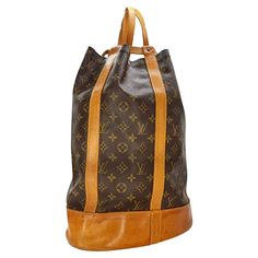 This Louis Vuitton Vintage Monogram Randonnee GM is a true statement piece. Made with exquisite detailing and Monogram canvas, its pure shape makes it an ideal city bag. Featuring a detachable interior pocket, this bucket bag is not only stylish but also functional. Retail price $1,600. Designer: Louis Vuitton Material: Monogram canvas w/ cowhide leather trim Date/Authenticity Code: A10994 Production Year: 1994 Origin: France Measurements: 16.75” W x 13” H x 6” D Strap Length: 15” Adjustable Interior Lining: canvas Pockets: One Removable Zip Pocket Opening/Closure: Open top with cinch strap Hardware: Golden color metallic pieces Includes: Entrupy Certificate Overall Condition: Very Good pre-owned vintage condition; shape has relaxed due to storing; exterior canvas is in great condition; le Mochila Louis Vuitton, Louis Vuitton Vintage Bag, Louis Vuitton Collection, Louis Vuitton Vintage, Vintage Monogram, Vintage Bag, City Bag, Vintage Louis Vuitton, 6 D