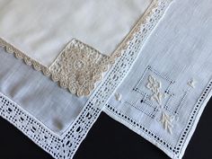 two pieces of white linen with lace on them