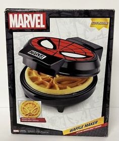 the box is open and has waffle maker in it's packaging on display