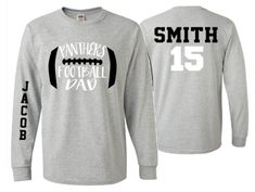 a gray long - sleeved football shirt with the number 15 on it and an american football