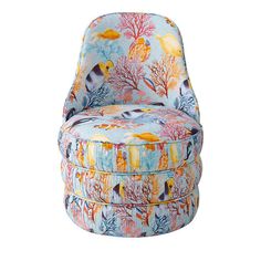 an upholstered chair with colorful corals and sea creatures on it, against a white background