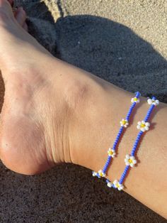 🌊 Handmade in Marina Del Rey, Southern California "Summer Daisies" Beaded Anklet is perfect for layering with other anklets, on the sandy beach, staycation at home or great to wear with any outfit. Each piece is unique as it is handmade and inspired daily. No two are alike. 🌊 Very Lightweight and comfortable 🌊 Premium quality Glass Seed Beads in size 12/0 (approx. 2mm and 3mm)  🌊 Durable nylon thread or Durable monofilament cord 🌊 Silver plated over alloy lobster clasp  🌊 2" extender chain added upon request Please note this order is for only one anklet with the bigger daisies. The smaller daisies are available under a different listing :) Colorful Beads Bracelet For Summer Beach, Colorful Beads Anklets For Summer Vacation, Summer Beach Anklets With Tiny Beads, Colorful Beaded Bracelets For Beach And Summer, Colorful Beaded Bracelet For Beach In Summer, Colorful Beaded Bracelets For Summer Beach, Colorful Beaded Anklets For Summer Vacation, Summer Anklets With Tiny Beads, Blue Flower Beaded Bracelets For Beach