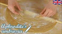 a person kneading dough on top of a wooden table with the words aphrodie's ambrosia