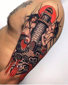 a man's arm with tattoos on it and an image of a lighthouse in the background