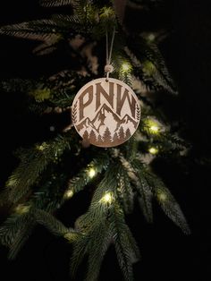 a wooden ornament hanging from a christmas tree