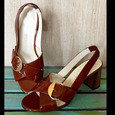 Anthropologie Bettye Muller Brown Rust Patent Leather Slingback Sandals Rusty Brown Patent Leather Criss Cross Straps With Gold Buckle Wood Grain Black Heel & Elastic On Slingback Leather Lined * Padded Footbed * Leather Sole New In Box * Retail Price: 328.00 * Fits True To Size 3" Wood Grain Block Heel Chic Patent Leather Slingback Sandals With Block Heel, Summer Patent Leather Slingback Pumps With Round Toe, Medium Width Open Toe Patent Leather Slingback Pumps, Medium Width Patent Leather Open Toe Slingback Pumps, Formal Slingback Sandals With 4-inch Heel For Summer, Summer Patent Leather Slingback Sandals, Summer Patent Leather Slingback Sandals With Ankle Strap, Summer Patent Leather Ankle Strap Slingback Sandals, Summer High Heel Patent Leather Slingback Sandals