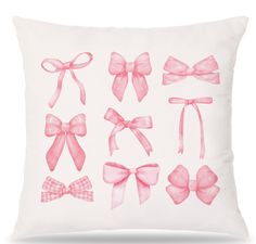 a pillow with pink bows on the front and back, all in different shapes and sizes