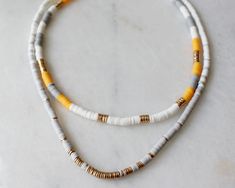 "more cute and fun necklaces and earrings in DearDanielleJewelry: https://www.etsy.com/shop/DearDanielleJewelry?ref=seller-platform-mcnav§ion_id=28417638 July4 necklace.multi heishi beads necklace. Surfer beads necklace. Summer beach necklace. Red white and blue rubber, polymer beads necklace Please pick your color: red and blue. pink and white. blue and green. Yellow and Grey adjustable necklace length: 16-18\" Bead size: 3/16\" diameter **framed gems and charms are gold plated which means you Vacation Beaded Necklaces With Colorful Heishi Beads, Multicolor Tiny Beads Necklaces For The Beach, Colorful Heishi Beads Necklace For Beach, Colorful Heishi Beads Beach Necklace, Hand-strung Heishi Beaded Necklaces For Beach, Rubber Bead, Polymer Beads, Beach Necklaces, Hippie Necklace