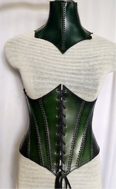 It is handmade leather under-bust corset with hand-sewn leather detailing. Fully adjustable at front with lace and back side with buckles. We used about 2 to 2.2 mm thick handmade leather. It is hand dyed handmade leather. It is crazy for medieval events and Larp.   Corset is hand made from sturdy top-grain leather.  Size is available from 30 to 46 inch, please check our size chart. It is handmade leather Neck Corset with hand-sewn by Embossed leather detailing. It's adjustable Lace in back side Fitted Leather Corset With Corset Back, Fitted Leather Overbust Corset, Fitted Leather Underbust Corset, Fitted Underbust Leather Corset, Steampunk Leather Corset Belt For Festivals, Steampunk Leather Corset Belt For Cosplay, Leather Steampunk Corset Belt For Festivals, Gothic Leather Corset Belt For Larp, Gothic Leather Overbust Corset