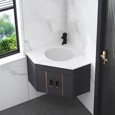 a bathroom with marble counter top and black cabinetry next to a window that looks out onto the outdoors