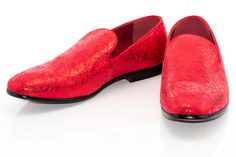 Steal glances in this smooth fitting, metallic styled loafer featuring an ornate embossed upper set atop a patent-black outsole, exuding a clean-cut, luxurious style for formal outfits. Formal Slip-on Loafers With Red Sole, Red Formal Dress Shoes For Spring, Red Spring Formal Dress Shoes, Elegant Loafers With Red Sole For Spring, Elegant Spring Loafers With Red Sole, Formal Slip-ons With Red Sole, Formal Wingtip Slip-ons For Spring, Spring Formal Loafers With Red Sole, Formal Patent Leather Loafers With Red Sole