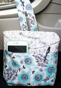 a cell phone in a purse on the back seat of a car