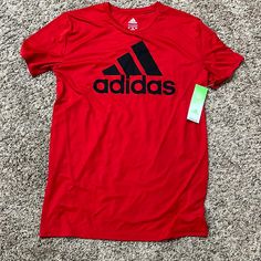 Adidas Nwt Boys (18-20) Red T-Shirt. Adidas Tops In University Red With Short Sleeves, Sporty Red Shirt With Letter Print, Adidas University Red Short Sleeve Top, Pre-shrunk Red T-shirt For Sports, Red Graphic Tee For Sports, Red Pre-shrunk T-shirt For Sports, Adidas Red Sporty Top, Red Short Sleeve Shirt With Logo Print, Red Adidas Sporty Top