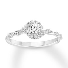 a white gold ring with diamonds on it