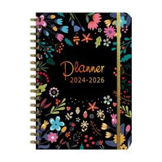 a black planner with colorful flowers on it