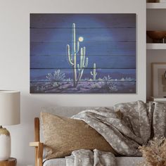 a living room filled with furniture and a painting on the wall