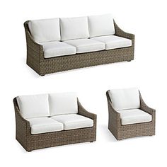 four pieces of outdoor furniture with white cushions