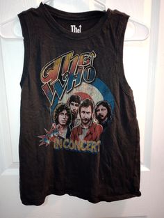 This is the Who t shirt in black or faded black. It has colorful graphics of the who. It is size small. Measurements are flat across shoulder 12 1/2", breast 20", hip 20", length lower shoulder down  vertical 23 1/2". Fitted Sleeveless Grunge T-shirt, Pre-shrunk Cotton Sleeveless T-shirt, Vintage Sleeveless T-shirt With Graphic Print, Fitted Cotton Muscle Tee With Graphic Print, Washed Black Grunge Tops With Letter Print, Vintage Cotton Top For Concert, Casual Acid Wash Cotton Muscle Tee, Y2k Cotton Tank Top With Graphic Print, Y2k Sleeveless T-shirt With Letter Print