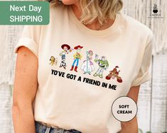 a woman wearing a t - shirt that says you've got a friend in me