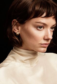 An everyday staple, the Gold Huggie Earrings flow along the curve of your ear. Hand cast in Brass and plated with 14K Gold Plate. Also available in Sterling Silver. Chic Gold Earrings For Work, Chic Gold Earrings For Workwear, Classic Yellow Gold Earrings For Work, Elegant Gold Earrings For Workwear, Elegant Gold Earrings For Work, Modern Yellow Gold Earrings For Workwear, Classic Gold Wrap Earrings, Huggie Earrings Gold, Huggie Earrings Silver