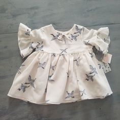 Adorable Nwt Pippa And Julie Heron Dress. Bell Sleeves And Tie Neck. Size 3-6 Months Playdate Flutter Sleeve Dress, Fitted Flutter Sleeve Dress For Playdate, White Flutter Sleeve Twirl Dress For Spring, White Flutter Sleeve Twirl Dress With Ruffles, Fitted Dress With Flutter Sleeve For Playdate, White Twirl Dress With Ruffles And Flutter Sleeves, Cute Dresses For Spring Baptism, Playful Baptism Dress With Ruffles, White Ruffled Twirl Dress For Spring