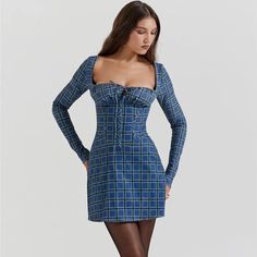 Discover Timeless Elegance Step into the new season with style in our Chic Tartan Backless Mini Dress, a perfect blend of classic charm and contemporary flair. Tailored for the modern woman, this dress is designed to make a statement at any spring or summer occasion. Whether you're attending a casual get-together or a sophisticated soiree, this dress promises to keep you at the forefront of fashion. Exquisite Features Our dress boasts a captivating square collar that elegantly frames the necklin Middle Aged Women, Backless Mini Dress, Tartan Pattern, Above Knee, Plaid Pattern, New Season, Modern Woman, Design Details, The Modern