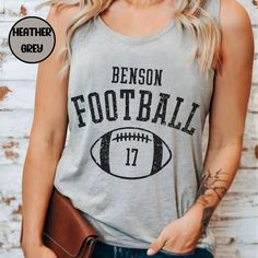 Elevate your game day apparel with this customized tank top with your players number & school mascot.  Makes for a Perfect gift-for football mom on those hot game days! These Tanks are made of high-quality cotton & polyester.  Thank you for browsing our shop, we hope you find something you enjoy! PRODUCT Women's next level 1533 Racerback Tank Top -Scooped neckline -classic fit -super soft & stretchy How to order: *Please review all photos in listing *Select the item size and color, quantity *Pro Team Spirit Tops With Team Name For Tailgating, Team Spirit Tops For Tailgating, School Spirit Tops For Football Season Tailgating, School Spirit Tops For Tailgating During Football Season, Team Spirit Tops For Tailgating During Football Season, Football Season Sports Fan Tops For Team Events, Sports Fan Tops For Football Season Team Events, Sports Fan Tops For Football Season, Sports Fan Sleeveless Tops For Game Day