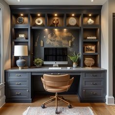 a home office with built in desk and shelves