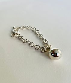 This simple and elegant sterling silver globe bracelet has been hand formed and polished by me. The bracelet is made of %100 925 sterling silver. The bracelet is minimalist, elegant and unique. So it is a comfortable to wear for any occassion. It is also perfect as statement bracelet. It will be a great gift for chunky and bold bracelet lovers! You may also check my '' Silver Globe Ring '' from the '' Rings '' section for to make perfect match! ------------------------------------------------------------------------------------------------------------------------------------------------------------ SIZES: Diameter of the globe is 16 mm From 6 to 10 inches including half sizes. If you need a size other than listed, please let me know, and I will customize the size for you. P.S: Custom sizes Sterling Silver Sphere-shaped Jewelry, Sterling Silver Oyster Bracelet For Everyday, Minimalist Sterling Silver Oyster Bracelet, Minimalist Ball Chain Bracelets As Gift, Silver Ball Chain Bracelet As Gift, Silver Ball Chain Bracelet Gift, Minimalist Sterling Silver Diamond Bracelet, Minimalist Ball Chain Bracelet As Gift, Minimalist Ball Chain Bracelet Gift