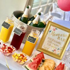 a table topped with lots of fruit and drinks